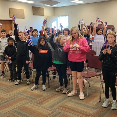 North School 4th Graders with flag education materials