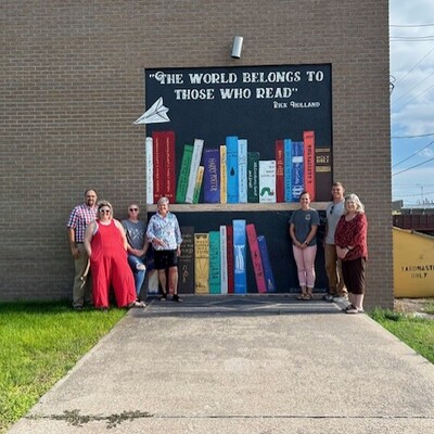 Board members with finished mural