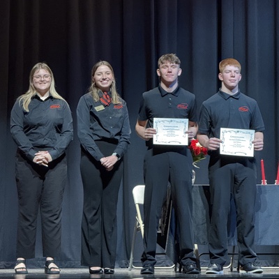 Chapter Members getting recognized on stage at the District Leadership Conference